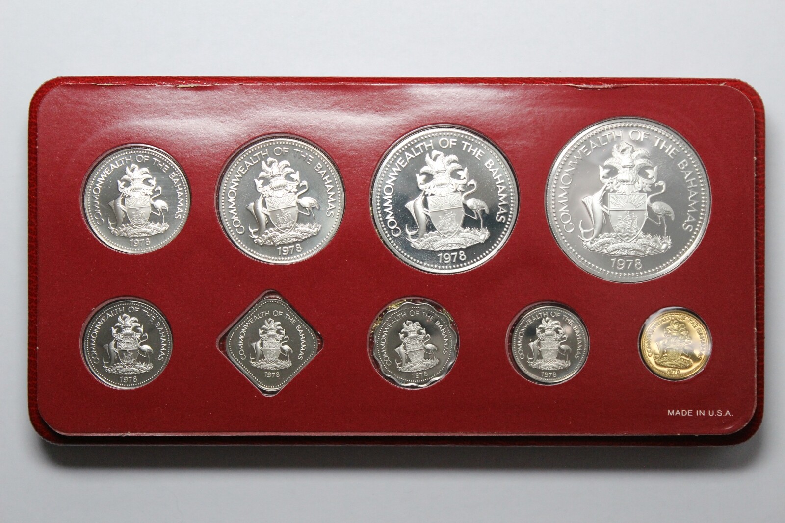 The 1975 Bahamas Proof Set features nine beautifully struck coins, including denominations from 1 cent to 5 dollars. Struck by the Franklin Mint in sterling silver (.925), the silver coins include the 50 cents, $1, $2, and $5 pieces