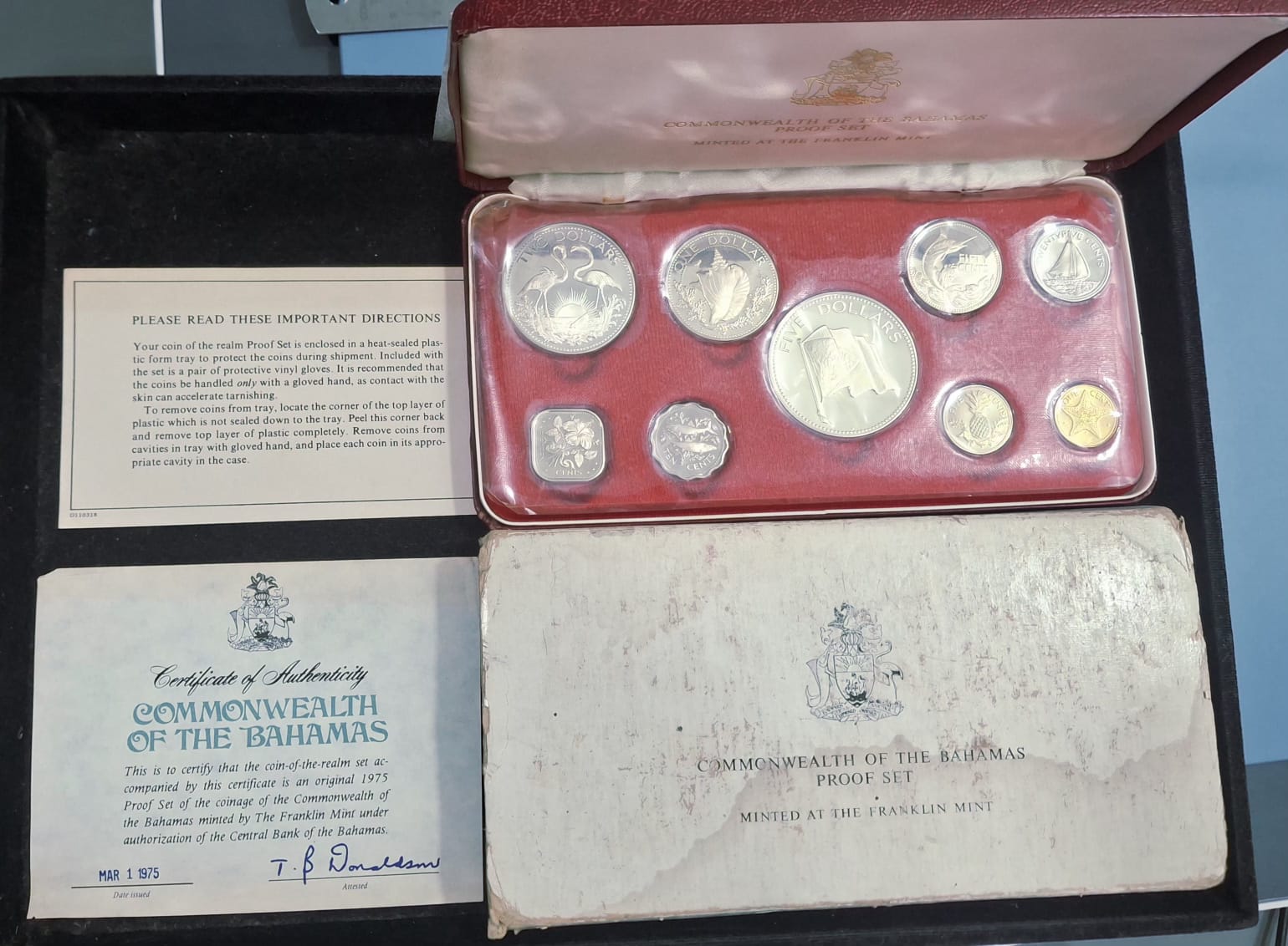 The 1975 Bahamas Proof Set features nine beautifully struck coins, including denominations from 1 cent to 5 dollars. Struck by the Franklin Mint in sterling silver (.925), the silver coins include the 50 cents, $1, $2, and $5 pieces