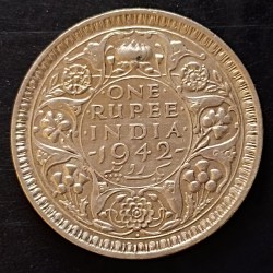 Silver British India denomination one rupees year 1942 excellent condition same and similar piece are available