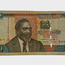 Kenya 50 Shillings Portrait 1st President of Kenya "MZEE JOMO Kenyatta" and Camel Caravan Bank Note in Collectable Grade.