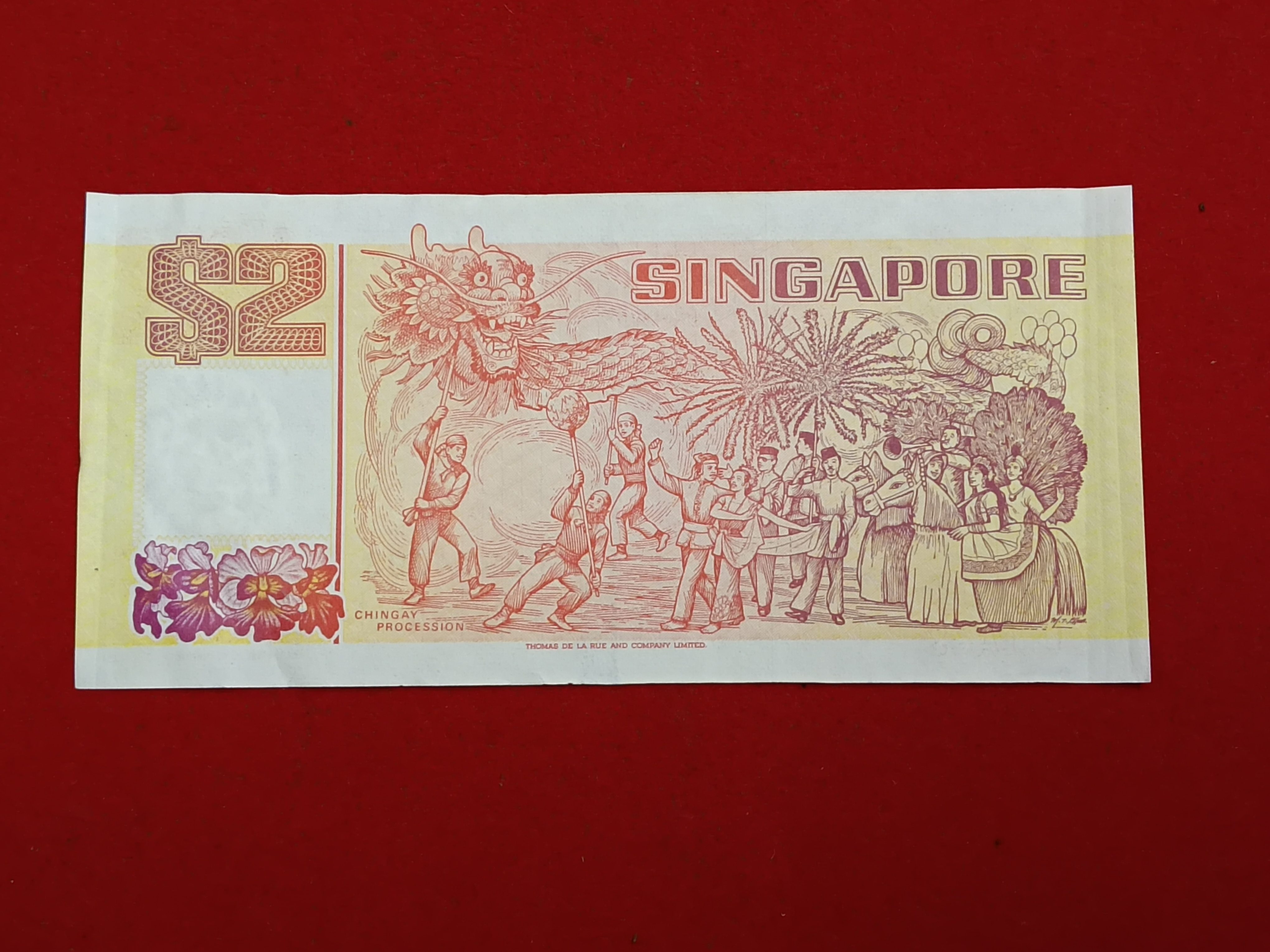 Rare Note Singapore 2 Dollar banknote featuring a traditional tongkang (light wooden boat) from Singapore's Ship Series first issued Gem Unc Condition